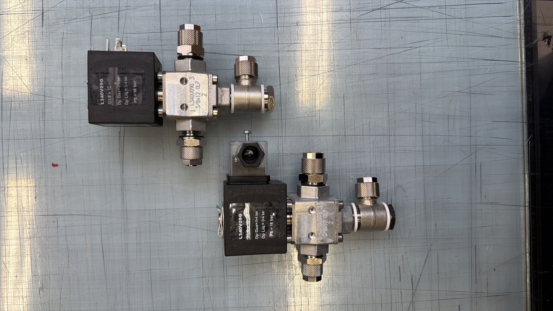 Two electric three-way valves on the workbench